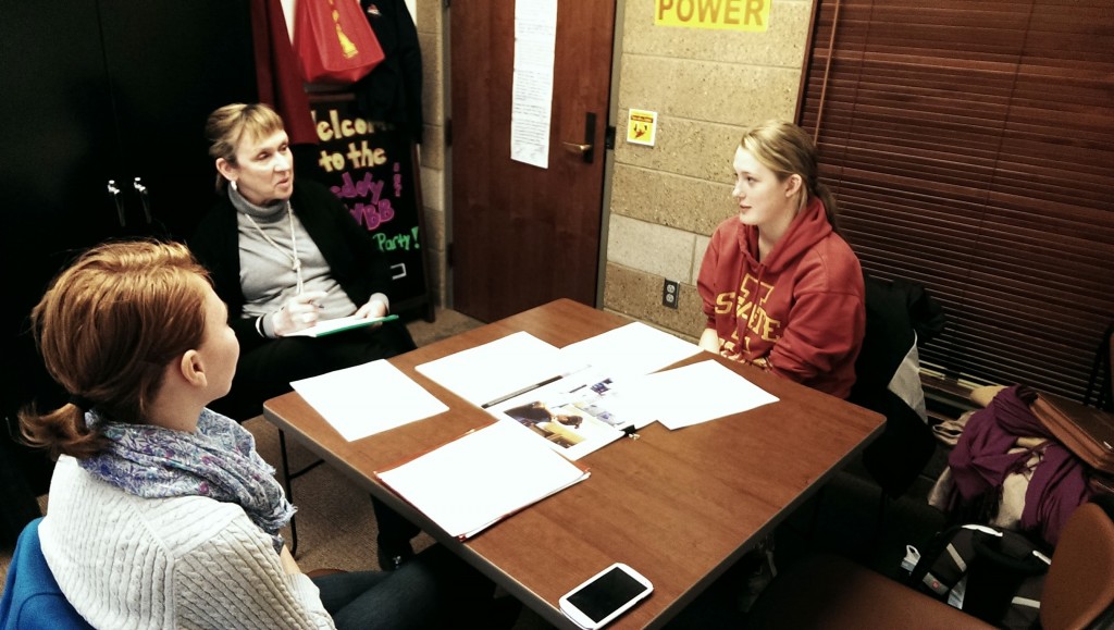 Britta Sortland discusses the Freddy Court Energy Challenge with Program Coordinator Mary Beth Golemo and student representative Jennifer Hunt. 