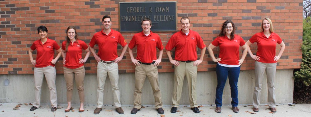 The 13-14 NECA cabinet members strike power-poses outside Town Engineering.